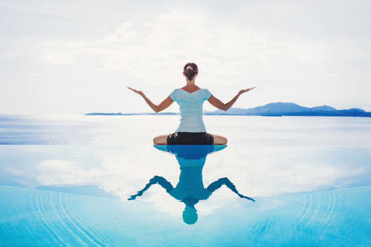 Young woman meditating outdoorsHarmony