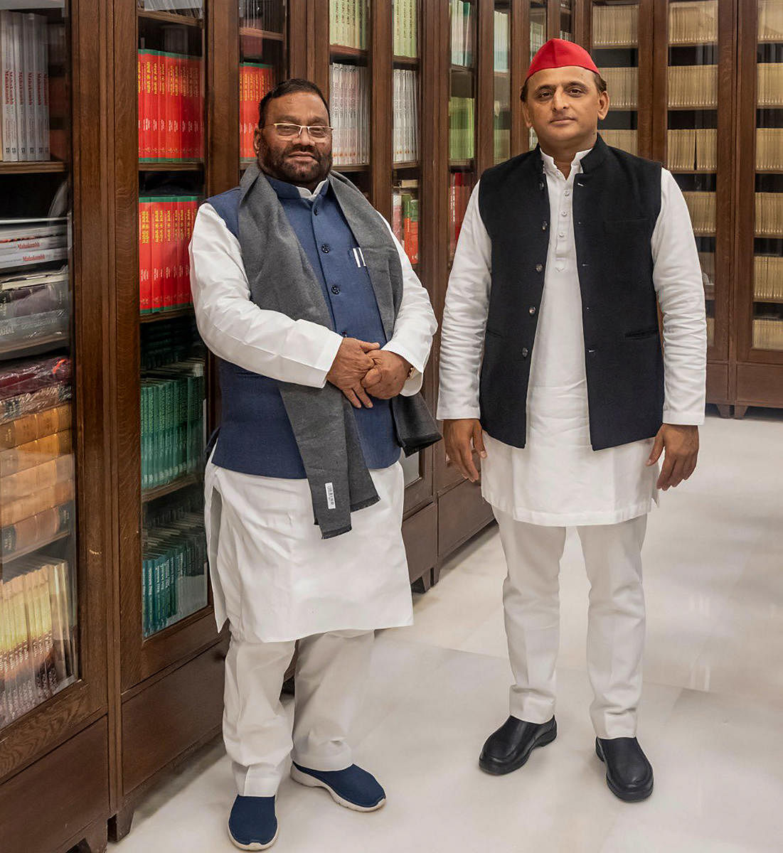 **EDS: IMAGE POSTED @yadavakhilesh** Lucknow: Former UP minister Swami Prasad Maurya (L) joins Samajwadi Party in the presence of the party chief Akhilesh Yadav, in Lucknow, Tuesday, Jan 11, 2022. (PTI Photo) (PTI01_11_2022_000058B)