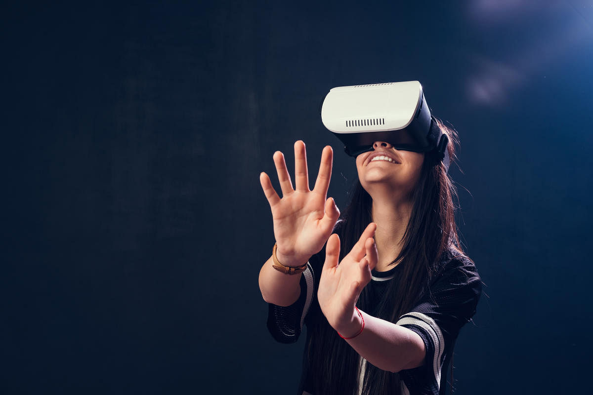 Teenage girl enjoying a VR simulatoriStock-649774844.jpg